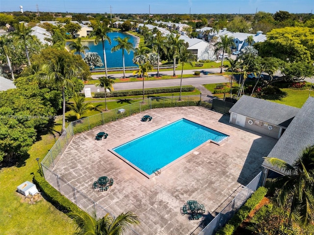 1111 Adams Ave Unit 1111B, Homestead, FL 33034 - community pool featuring a patio area, a water view, and fence