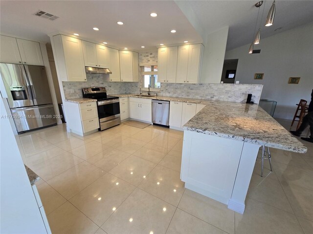 5645 Lakeview Mews Dr, Boynton Beach, FL 33437 - mediterranean / spanish-style home with stucco siding, a garage, and decorative driveway