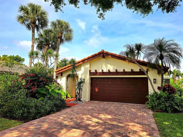 5645 Lakeview Mews Dr, Boynton Beach, FL 33437 - living room with healthy amount of natural light, a ceiling fan, vaulted ceiling, light tile patterned floors, and a textured ceiling