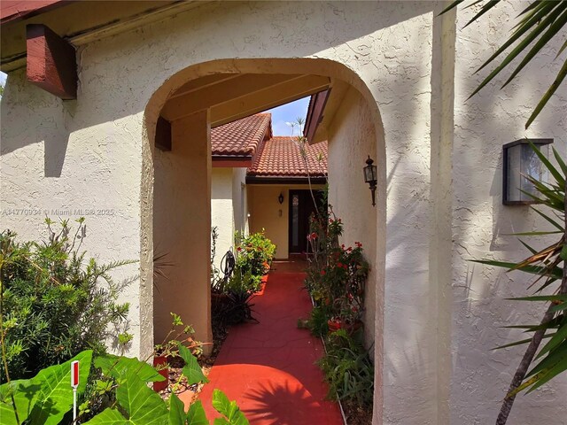5645 Lakeview Mews Dr, Boynton Beach, FL 33437 - property entrance featuring stucco siding and a tile roof