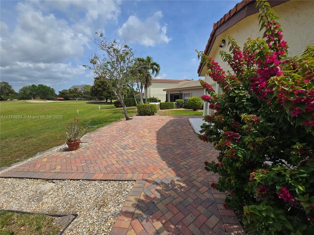 5645 Lakeview Mews Dr, Boynton Beach, FL 33437 - living area featuring a textured ceiling, ceiling fan, and light tile patterned floors