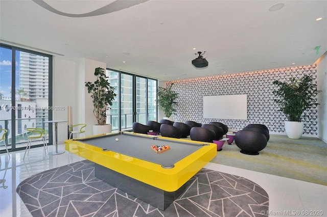 game room featuring pool table, recessed lighting, and a wall of windows