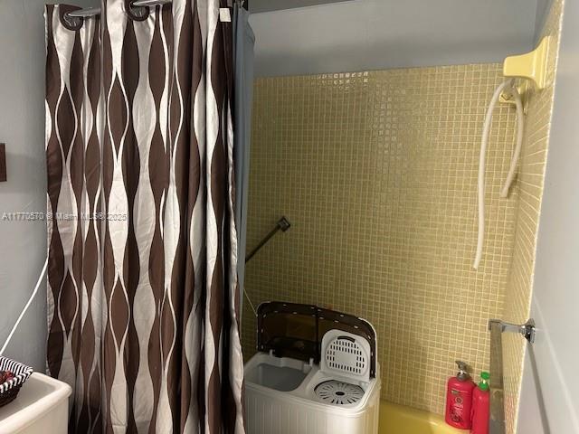 bathroom with a shower with curtain