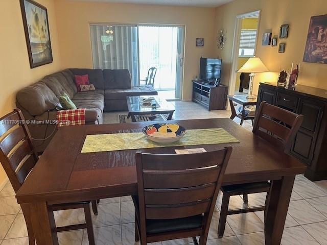 dining area with light tile patterned flooring