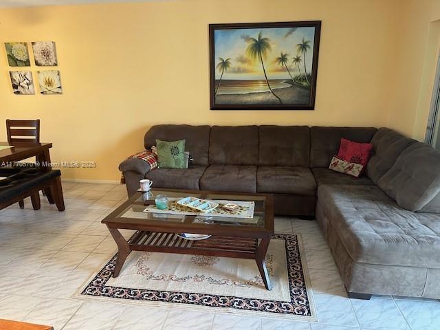 living room featuring baseboards