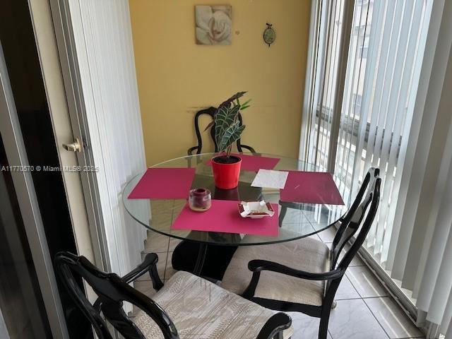 dining space with tile patterned floors