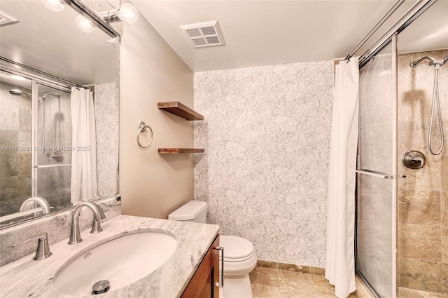 bathroom featuring a shower stall, visible vents, toilet, and vanity