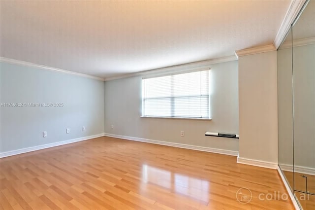 10140 W Bay Harbor Dr Unit 502B, Bay Harbor Islands, FL 33154 - empty room with crown molding and light wood-style flooring