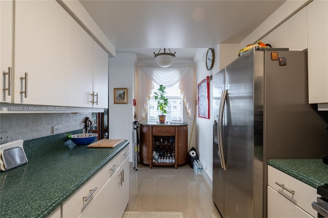 10140 W Bay Harbor Dr Unit 502B, Bay Harbor Islands, FL 33154 - kitchen with stainless steel fridge with ice dispenser, white cabinets, and light tile patterned floors
