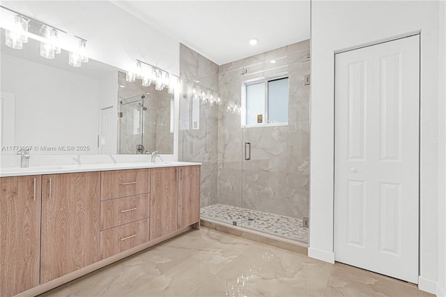full bath with marble finish floor, a sink, double vanity, and a shower stall