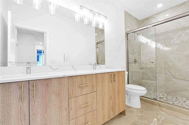 bathroom with toilet, double vanity, and a marble finish shower