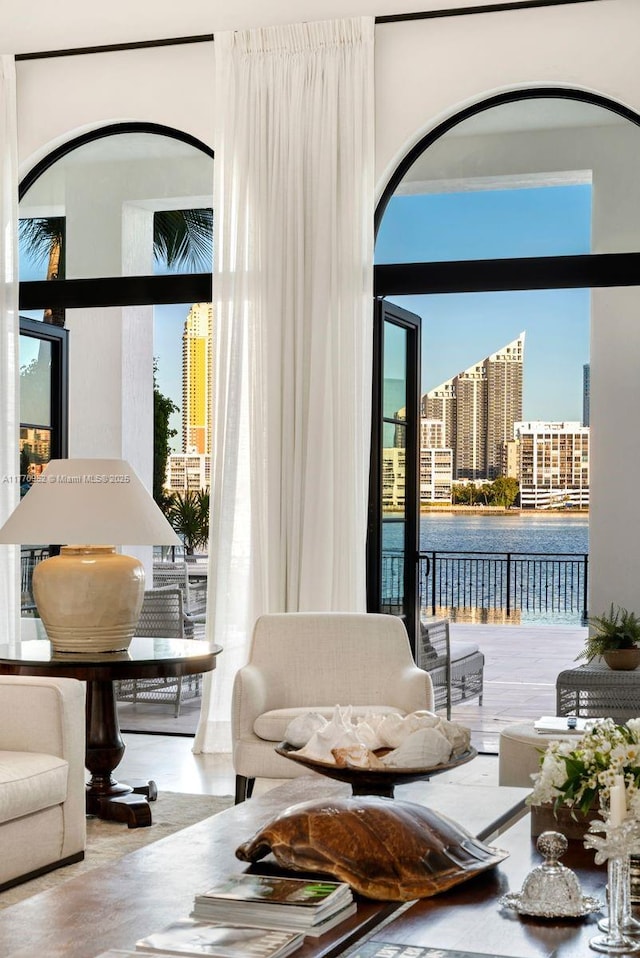 3918 Island Estates Dr, Aventura, FL 33160 - living room featuring arched walkways, a view of city, and a healthy amount of sunlight