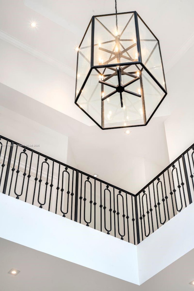 3918 Island Estates Dr, Aventura, FL 33160 - room details featuring crown molding and an inviting chandelier