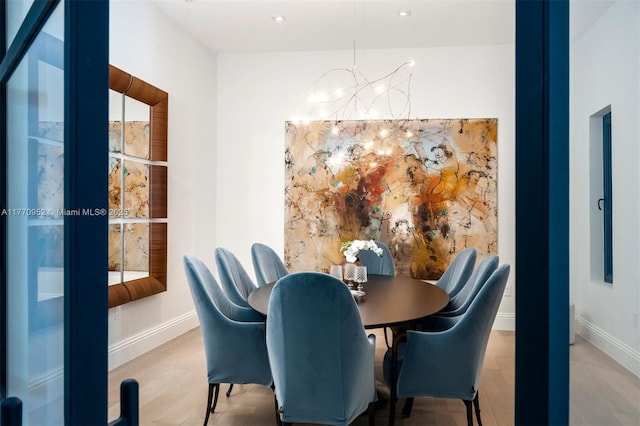 3918 Island Estates Dr, Aventura, FL 33160 - dining area featuring a chandelier, baseboards, and wood finished floors
