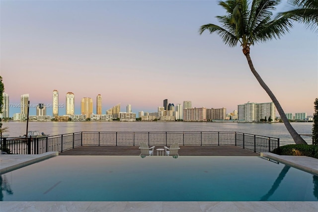 3918 Island Estates Dr, Aventura, FL 33160 - pool at dusk with a water view and a view of city