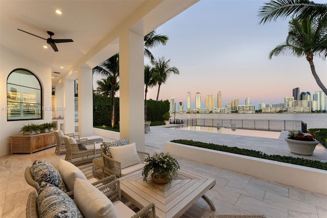 3918 Island Estates Dr, Aventura, FL 33160 - patio terrace at dusk with a city view, a ceiling fan, and an outdoor hangout area