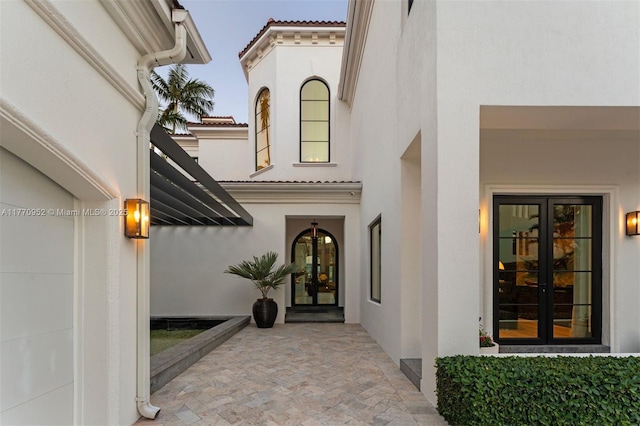 3918 Island Estates Dr, Aventura, FL 33160 - doorway to property featuring french doors, a tile roof, and stucco siding