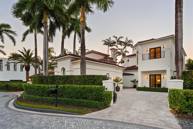 3918 Island Estates Dr, Aventura, FL 33160 - mediterranean / spanish house with a tile roof, stucco siding, driveway, and a balcony