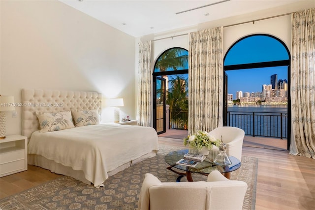 3918 Island Estates Dr, Aventura, FL 33160 - bedroom featuring access to outside, wood finished floors, and a city view