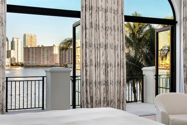 3918 Island Estates Dr, Aventura, FL 33160 - bedroom with a water view, access to outside, a city view, and expansive windows
