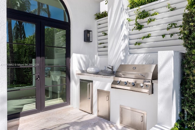 3918 Island Estates Dr, Aventura, FL 33160 - view of patio featuring a grill, french doors, and exterior kitchen