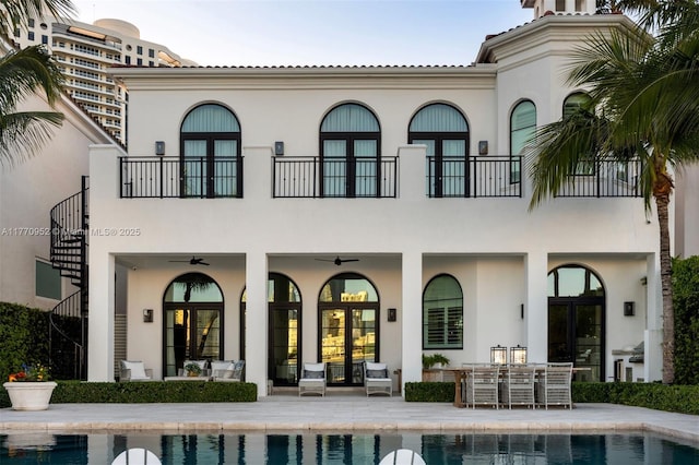 3918 Island Estates Dr, Aventura, FL 33160 - rear view of property featuring a patio area, a ceiling fan, stairway, stucco siding, and french doors