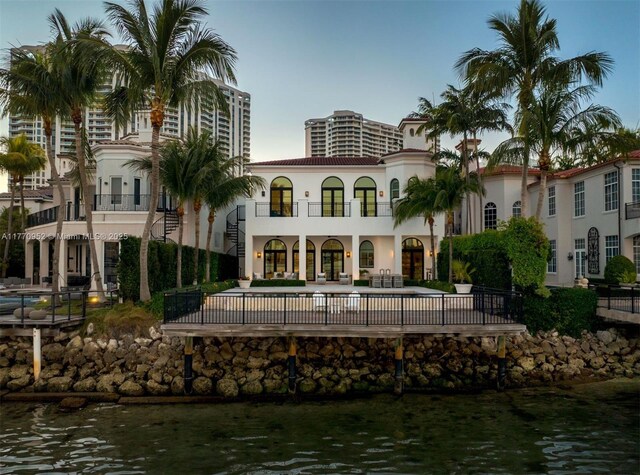 3918 Island Estates Dr, Aventura, FL 33160 - back of house featuring stucco siding and a tiled roof