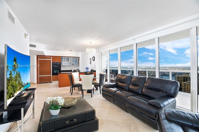 1830 S Ocean Dr Unit 2808, Hallandale Beach, FL 33009 - living area with a chandelier, light tile patterned flooring, and expansive windows