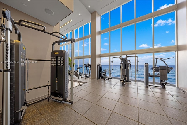1830 S Ocean Dr Unit 2808, Hallandale Beach, FL 33009 - workout area featuring a towering ceiling, a water view, and expansive windows