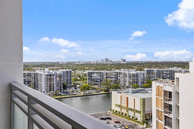 balcony featuring a water view and a view of city