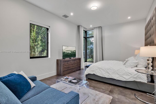 3232 Emathla St, Miami, FL 33133 - bedroom featuring finished concrete flooring, recessed lighting, and baseboards