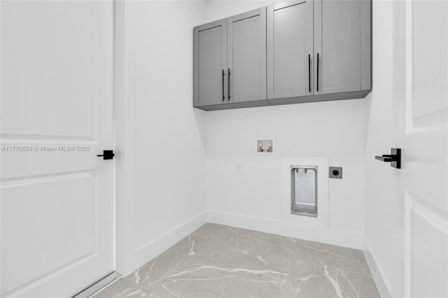 3217 SW 23rd St, Lehigh Acres, FL 33976 - laundry area with hookup for a washing machine, cabinet space, baseboards, and electric dryer hookup