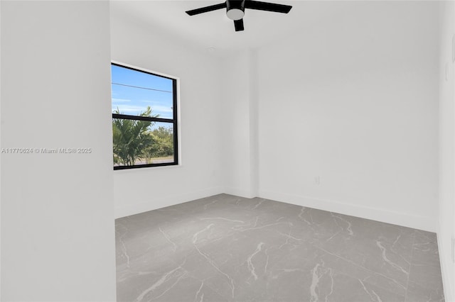 3217 SW 23rd St, Lehigh Acres, FL 33976 - empty room featuring a ceiling fan, concrete flooring, and baseboards