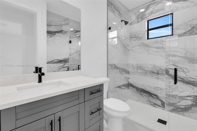 3217 SW 23rd St, Lehigh Acres, FL 33976 - bathroom featuring a marble finish shower, toilet, and vanity