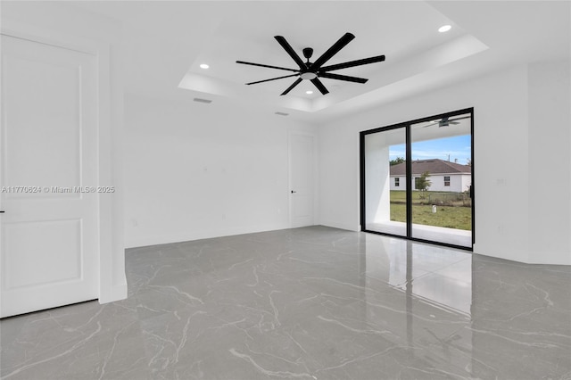 3217 SW 23rd St, Lehigh Acres, FL 33976 - unfurnished room with a ceiling fan, a tray ceiling, and recessed lighting