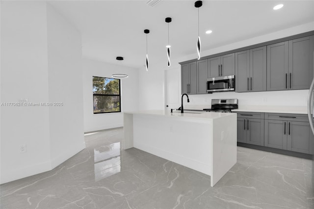 3217 SW 23rd St, Lehigh Acres, FL 33976 - kitchen featuring marble finish floor, a sink, gray cabinets, and appliances with stainless steel finishes