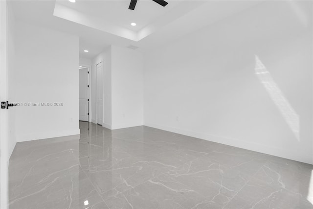 3217 SW 23rd St, Lehigh Acres, FL 33976 - unfurnished room featuring baseboards, a tray ceiling, recessed lighting, and a ceiling fan