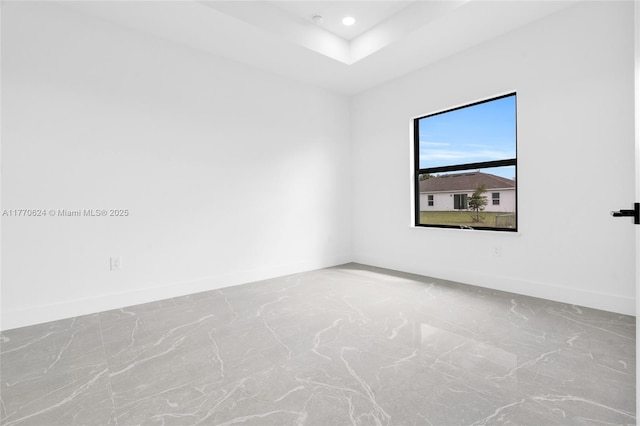 3217 SW 23rd St, Lehigh Acres, FL 33976 - spare room with baseboards, recessed lighting, and a raised ceiling