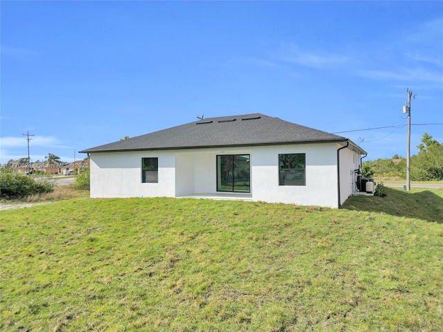 3217 SW 23rd St, Lehigh Acres, FL 33976 - rear view of house with a lawn, a patio, and stucco siding
