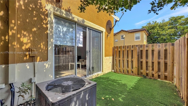 9259 SW 227th St Unit 1-25, Cutler Bay, FL 33190 - view of yard with central air condition unit and fence