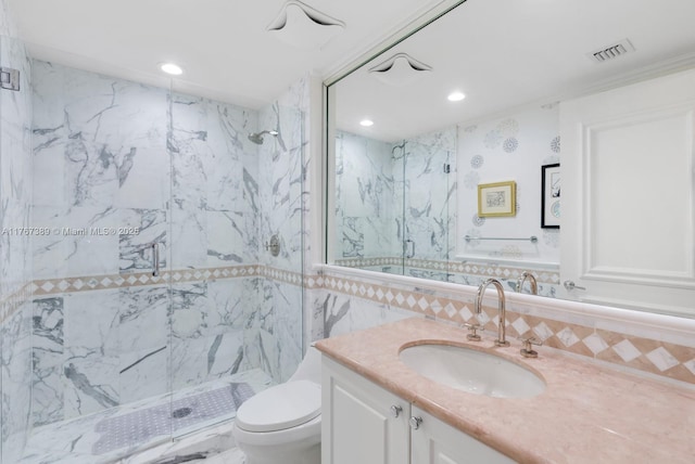 full bathroom with toilet, visible vents, a marble finish shower, and recessed lighting
