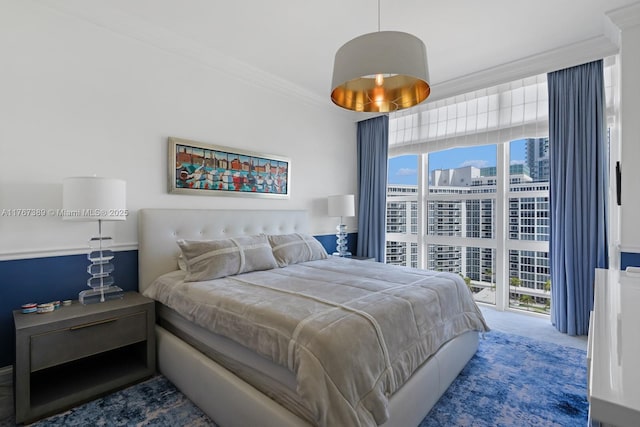 bedroom featuring crown molding and carpet flooring