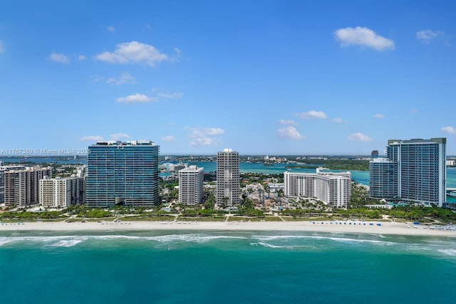 bird's eye view with a view of the beach, a city view, and a water view