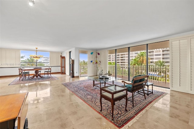1 Grove Isle Dr Unit A409, Miami, FL 33133 - living area featuring a chandelier
