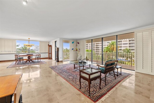 1 Grove Isle Dr Unit A409, Miami, FL 33133 - living area with a chandelier