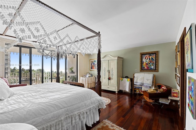 1 Grove Isle Dr Unit A409, Miami, FL 33133 - bedroom with hardwood / wood-style floors and expansive windows