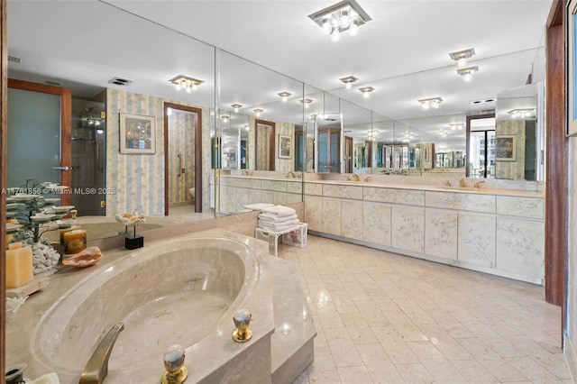 1 Grove Isle Dr Unit A409, Miami, FL 33133 - bathroom with vanity and a bath