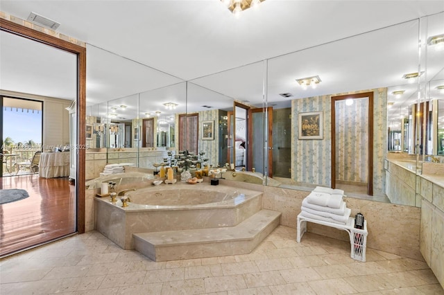 1 Grove Isle Dr Unit A409, Miami, FL 33133 - bathroom with a garden tub and vanity