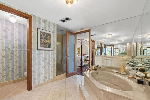 1 Grove Isle Dr Unit A409, Miami, FL 33133 - bathroom featuring wallpapered walls and a whirlpool tub