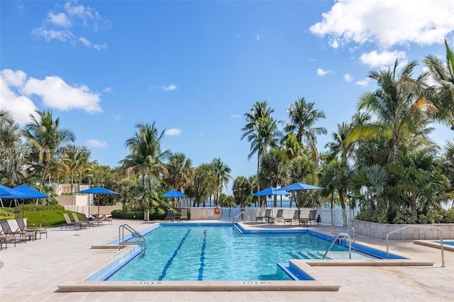 1 Grove Isle Dr Unit A409, Miami, FL 33133 - community pool featuring a patio
